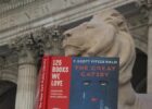 The lion "Fortitude" in front of the New York Public Library reads the "Great Gatsby"